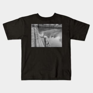 Metal barrier on the waterfront Kids T-Shirt